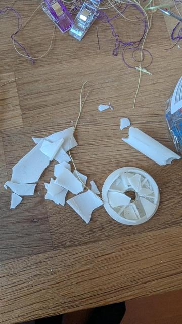 Photo of the smashed pieces of a plastic spool