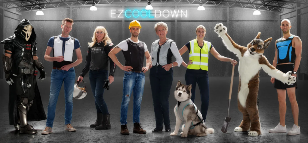 Promotional photo with several people standing in front of a neon sign that says EZ Cool Down: a cosplayer, a person in jeans, someone in motorcycle gear with a helmet, a construction worker, an older woman with a husky dog, a worker in a hi-viz vest, a fursuiter fox, and someone in athletic gear